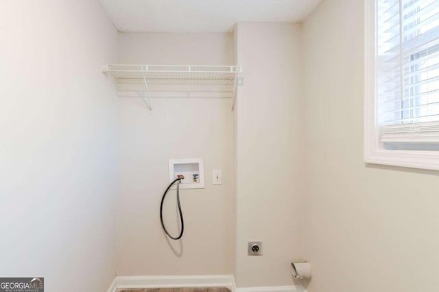 clothes washing area featuring washer hookup and hookup for an electric dryer