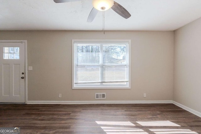 entryway with ceiling fan and dark hardwood / wood-style flooring