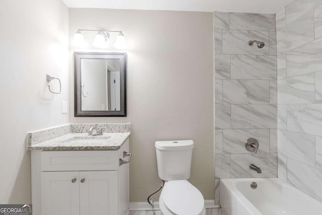 full bathroom with toilet, vanity, and tiled shower / bath combo