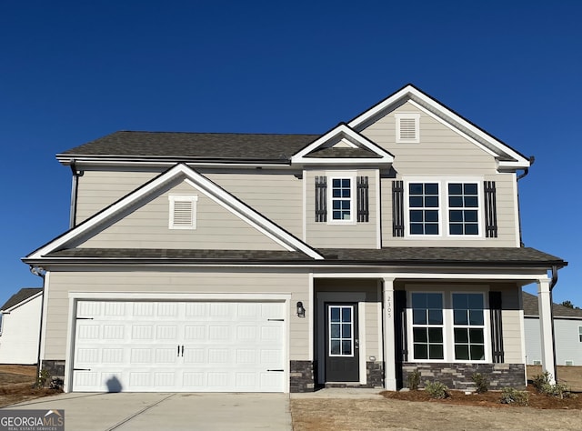 craftsman inspired home with a garage