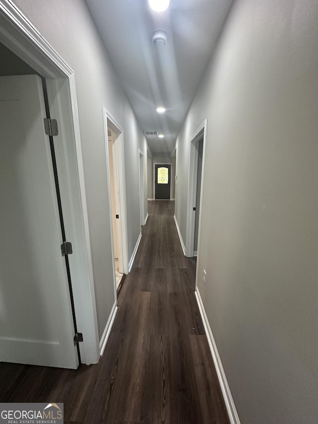 hallway featuring dark hardwood / wood-style floors