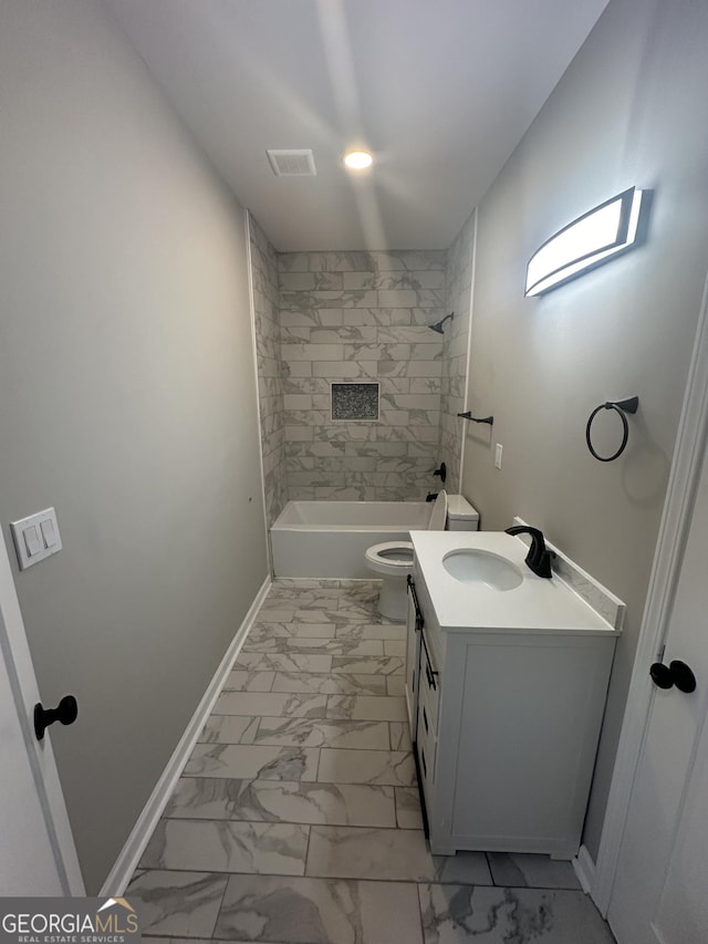 full bathroom featuring vanity, toilet, and tiled shower / bath combo