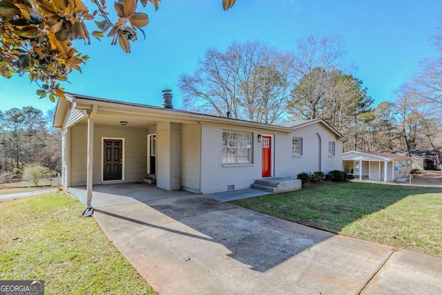 ranch-style house with a front yard and a carport