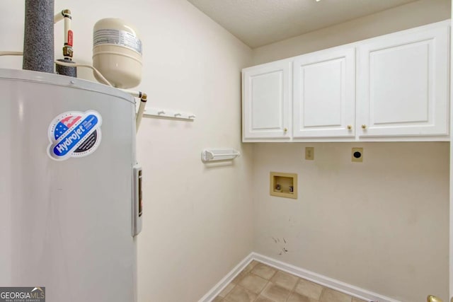 clothes washing area with hookup for an electric dryer, washer hookup, electric water heater, and cabinets