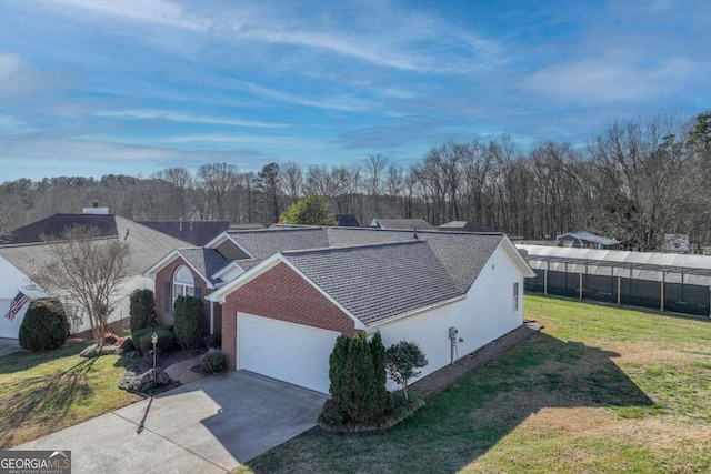 view of front facade with a front yard and a garage