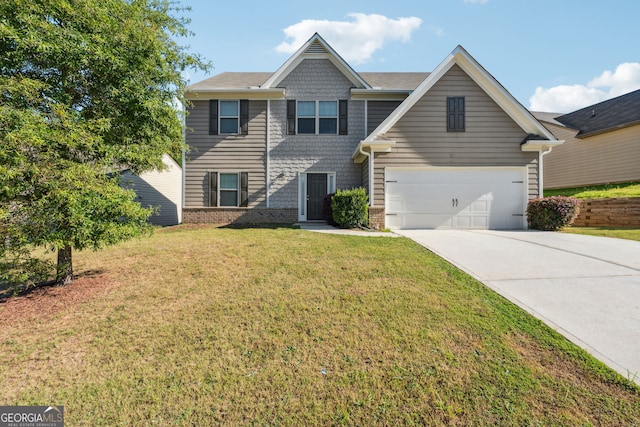 view of front of house with a garage and a front yard