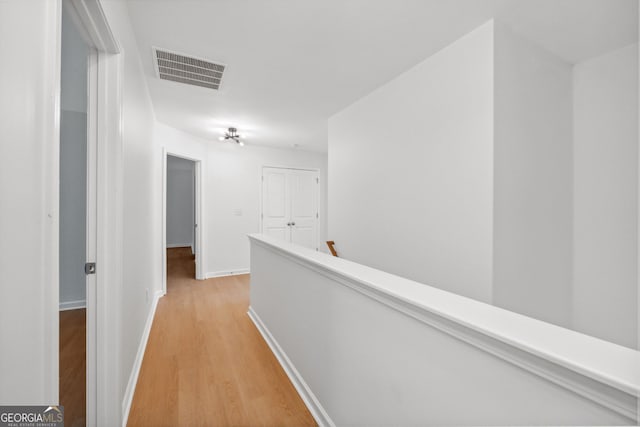 hallway with light wood-type flooring