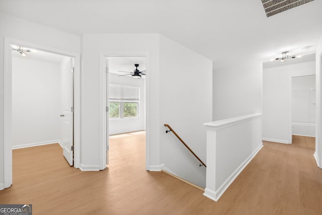 corridor with light wood-type flooring