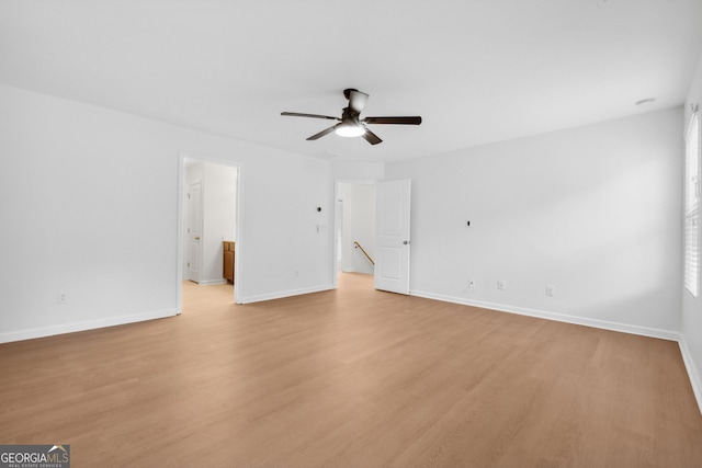 unfurnished room with light hardwood / wood-style flooring and ceiling fan