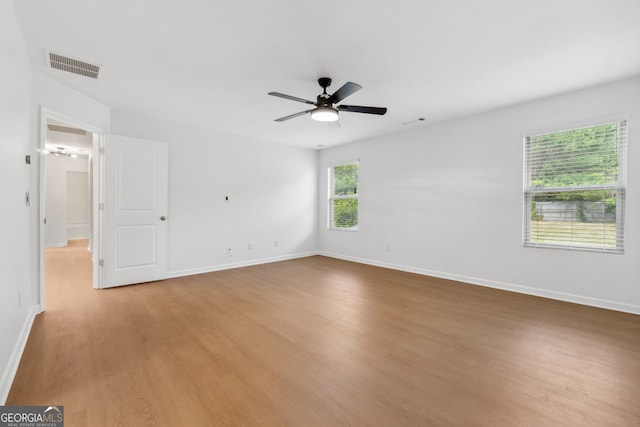 unfurnished room featuring ceiling fan and wood-type flooring