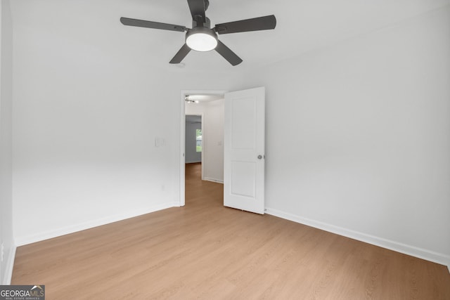 spare room featuring ceiling fan and light wood-type flooring