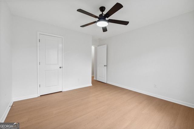 unfurnished bedroom featuring ceiling fan and light hardwood / wood-style floors