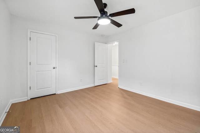 spare room with ceiling fan and light hardwood / wood-style floors