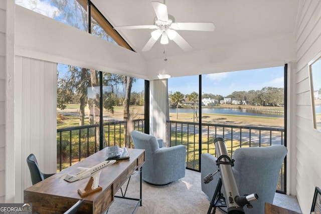 sunroom with lofted ceiling, ceiling fan, and a water view