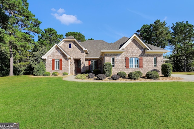 craftsman inspired home with a front lawn