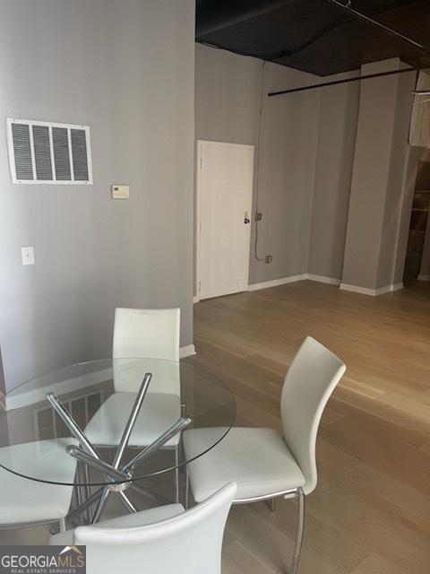 dining room with hardwood / wood-style flooring