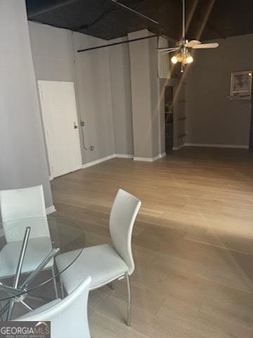 dining room featuring hardwood / wood-style flooring and ceiling fan