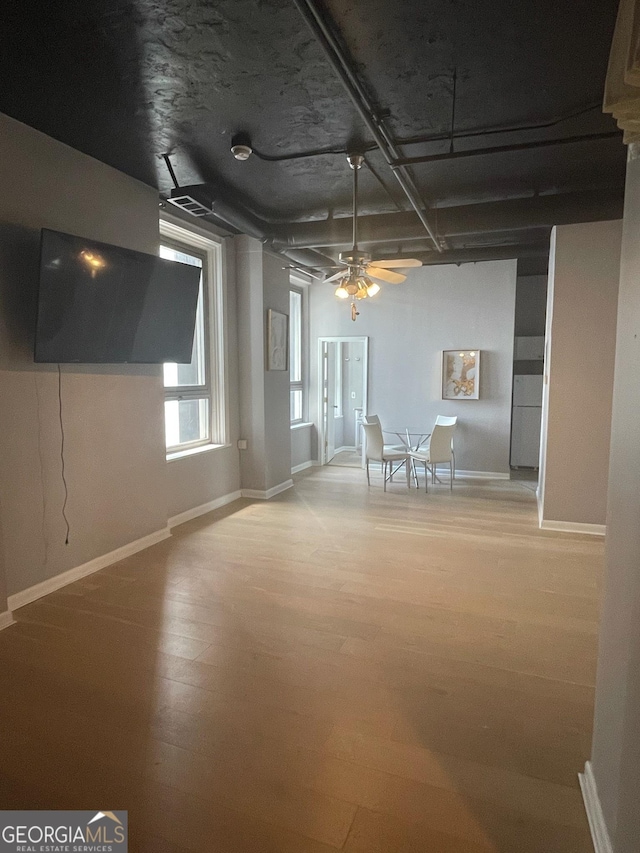 interior space with ceiling fan and light hardwood / wood-style floors