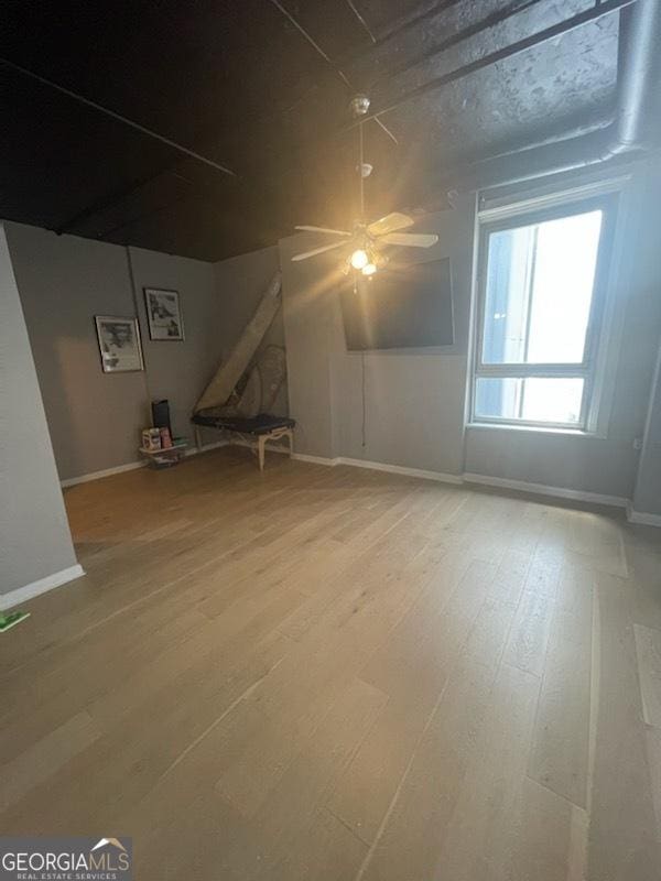 bonus room featuring hardwood / wood-style floors and ceiling fan