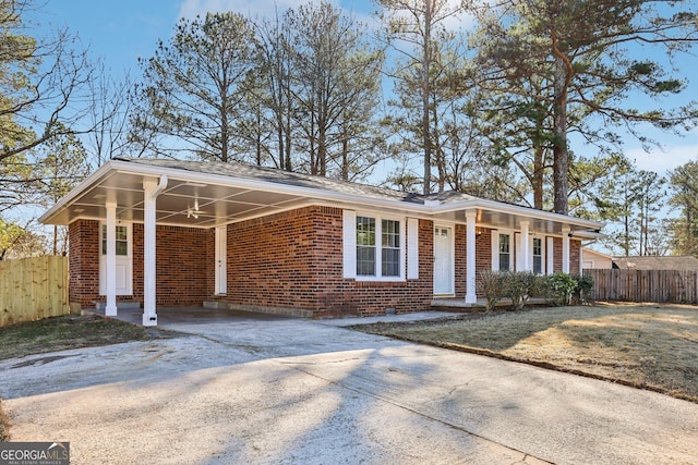 single story home with a carport and a front yard