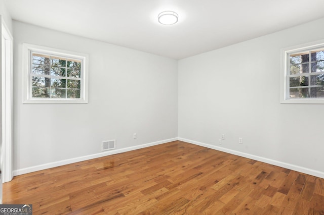 spare room featuring hardwood / wood-style flooring