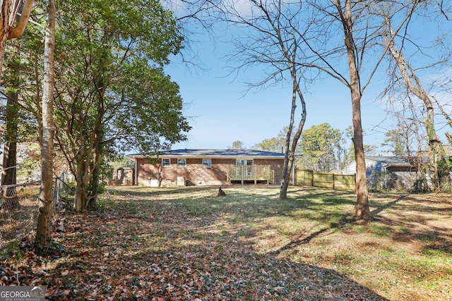 view of yard featuring a deck