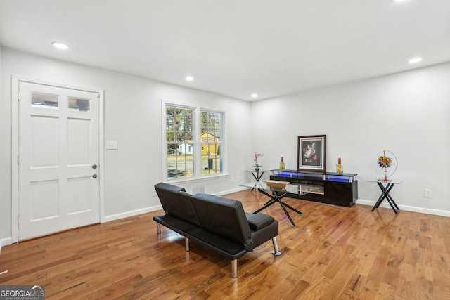 living area with light hardwood / wood-style floors