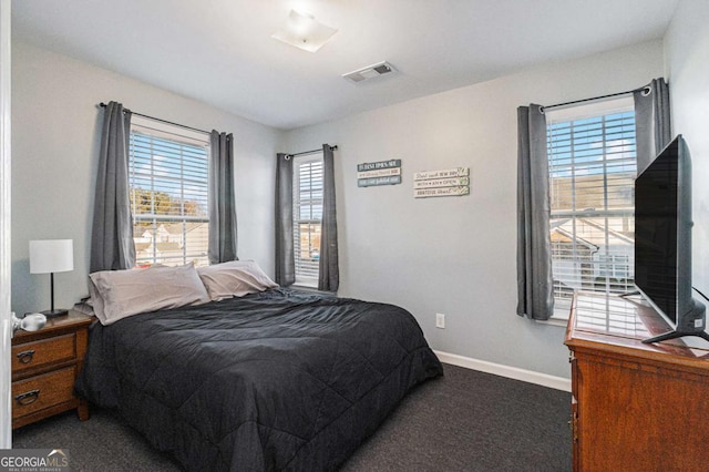 bedroom featuring dark colored carpet