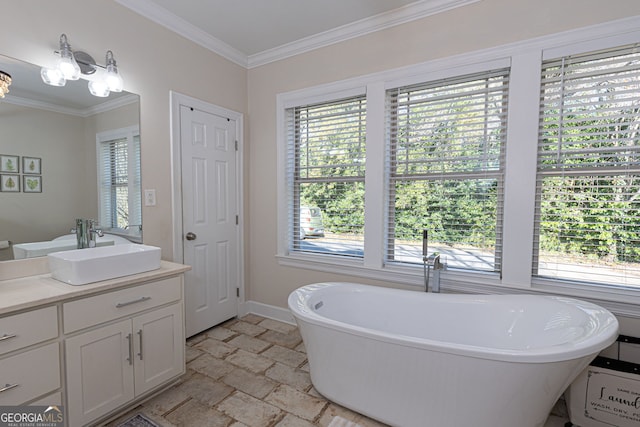 bathroom with crown molding, vanity, a bath, and an inviting chandelier