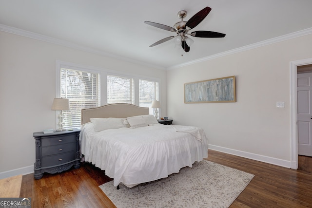 bedroom featuring crown molding, ceiling fan, and dark wood-type flooring