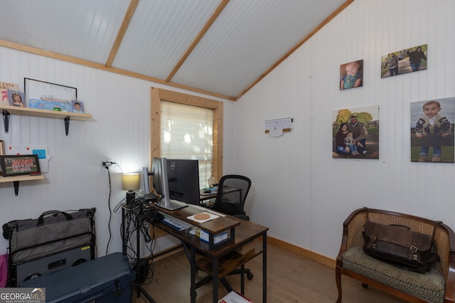 office featuring vaulted ceiling and hardwood / wood-style flooring