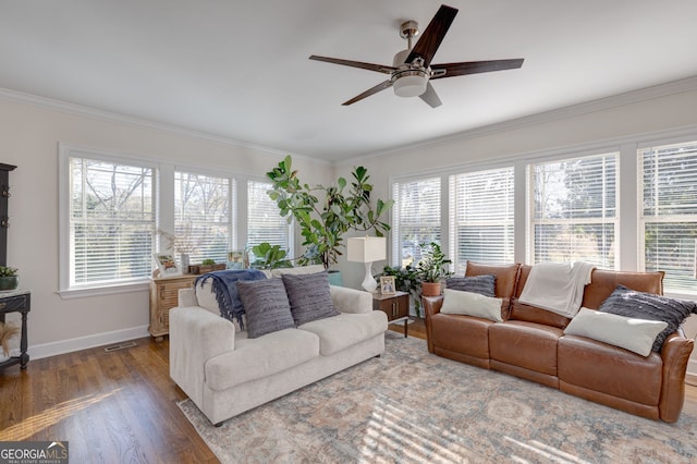 living room featuring ceiling fan, hardwood / wood-style floors, and crown molding