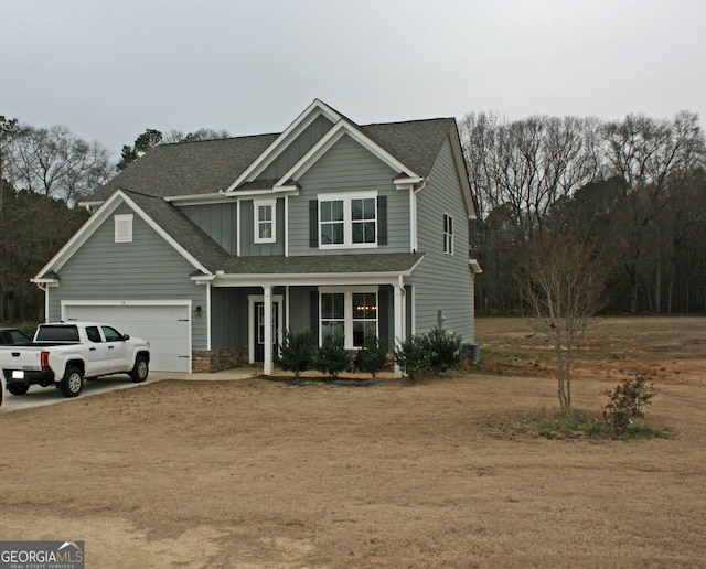 view of front of house with a garage and a porch