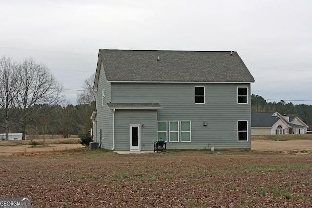 rear view of property featuring a patio area and central AC unit