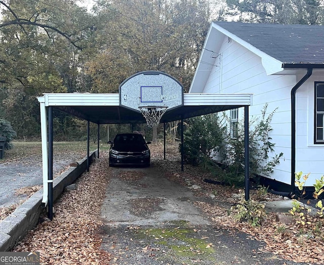 view of parking / parking lot featuring a carport