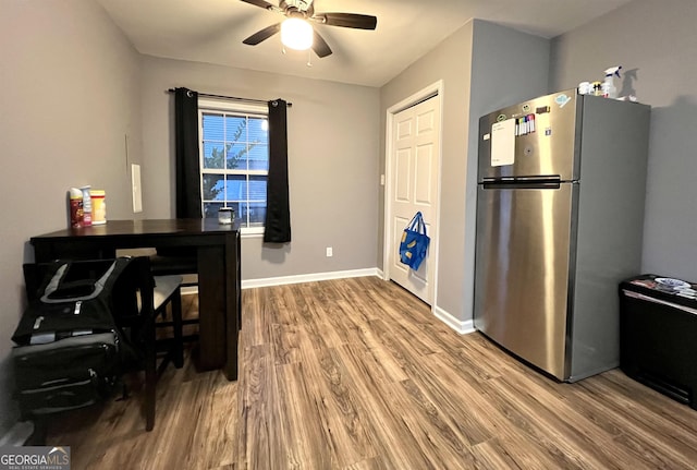 kitchen featuring stainless steel fridge, ceiling fan, and hardwood / wood-style floors