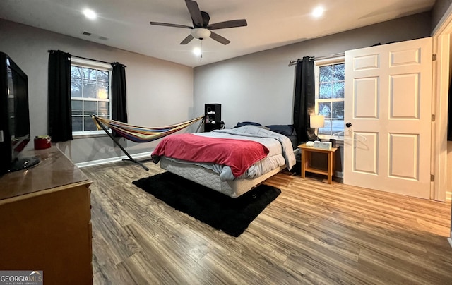 bedroom featuring ceiling fan and hardwood / wood-style floors