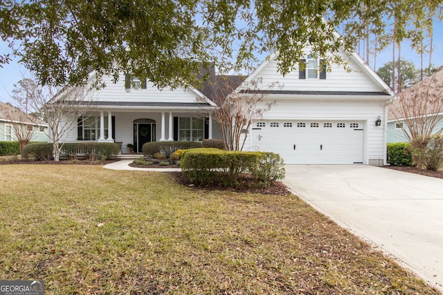 view of front property featuring a garage, a front yard, and covered porch