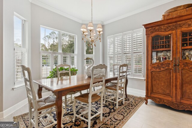 bedroom with connected bathroom, hardwood / wood-style flooring, ornamental molding, ceiling fan, and a tray ceiling