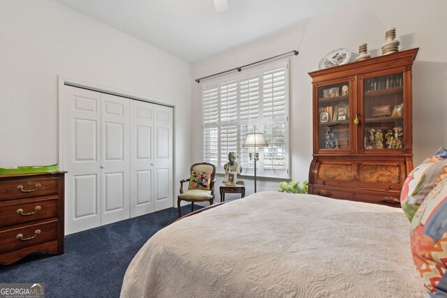 bedroom featuring dark colored carpet