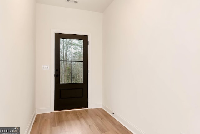 doorway with light hardwood / wood-style flooring