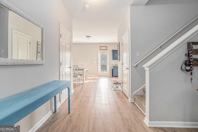 hallway with light wood-type flooring