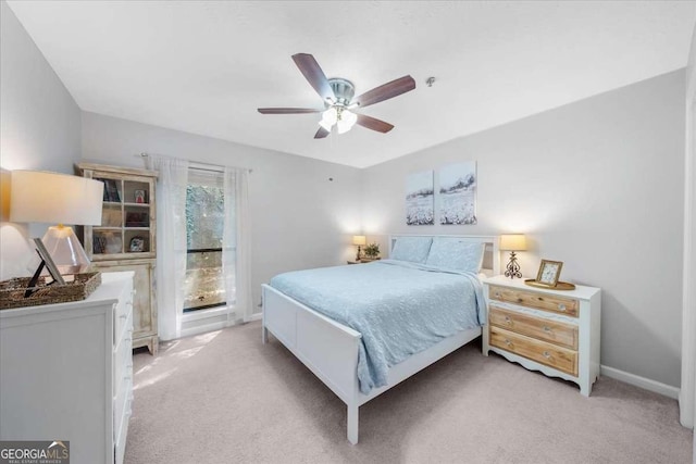 bedroom featuring light carpet and ceiling fan