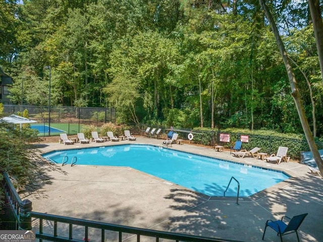 view of swimming pool featuring a patio