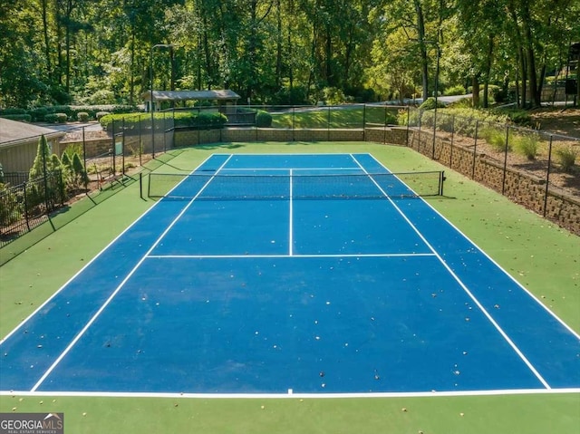 view of sport court with basketball hoop