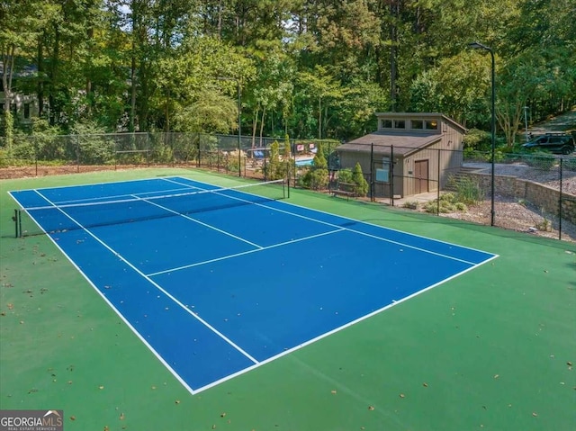 view of tennis court featuring basketball court