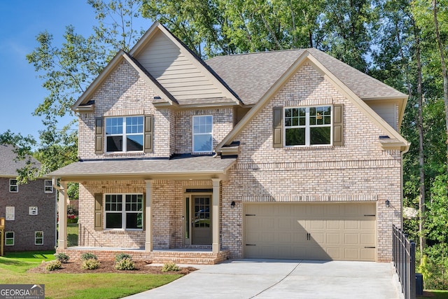 view of front of house with a porch and a garage