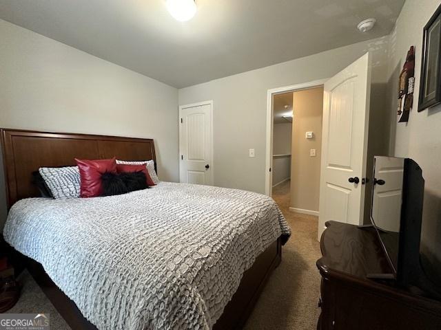 bedroom with dark carpet