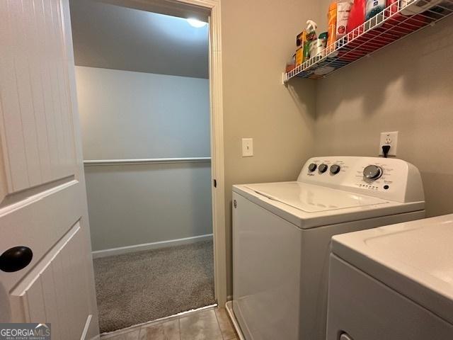 washroom featuring light colored carpet and independent washer and dryer