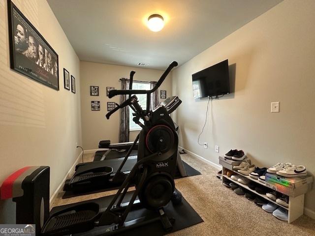 workout room featuring carpet floors